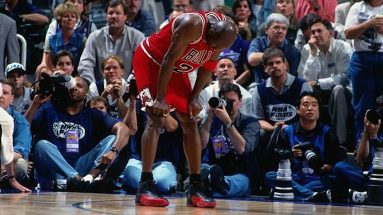 Michael Jordan wearing the Air Jordan 12 Flu Game